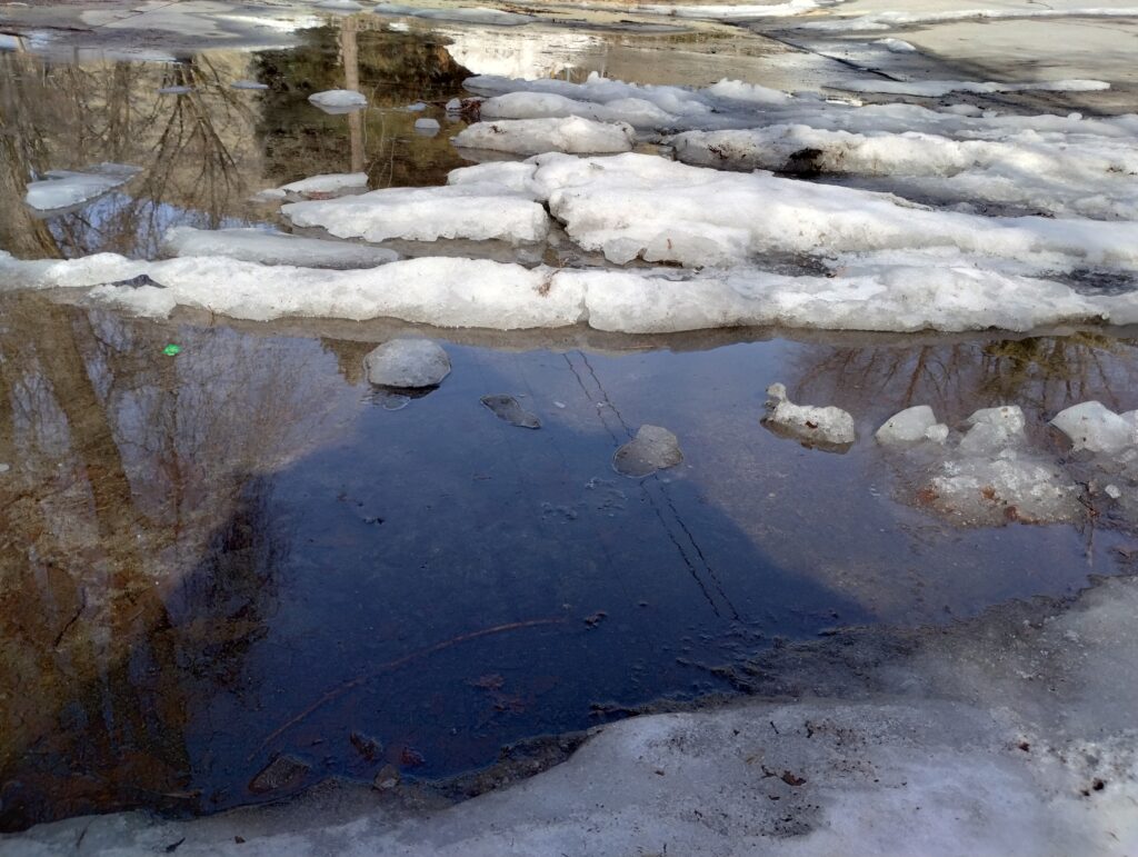 Snow melting on water.